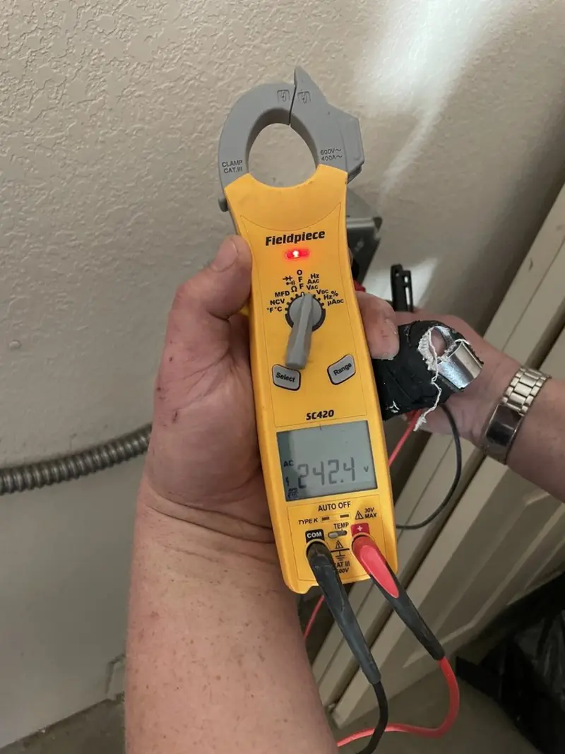 Voltage testing with clamp meter during Whole House Surge Protector in Buckner